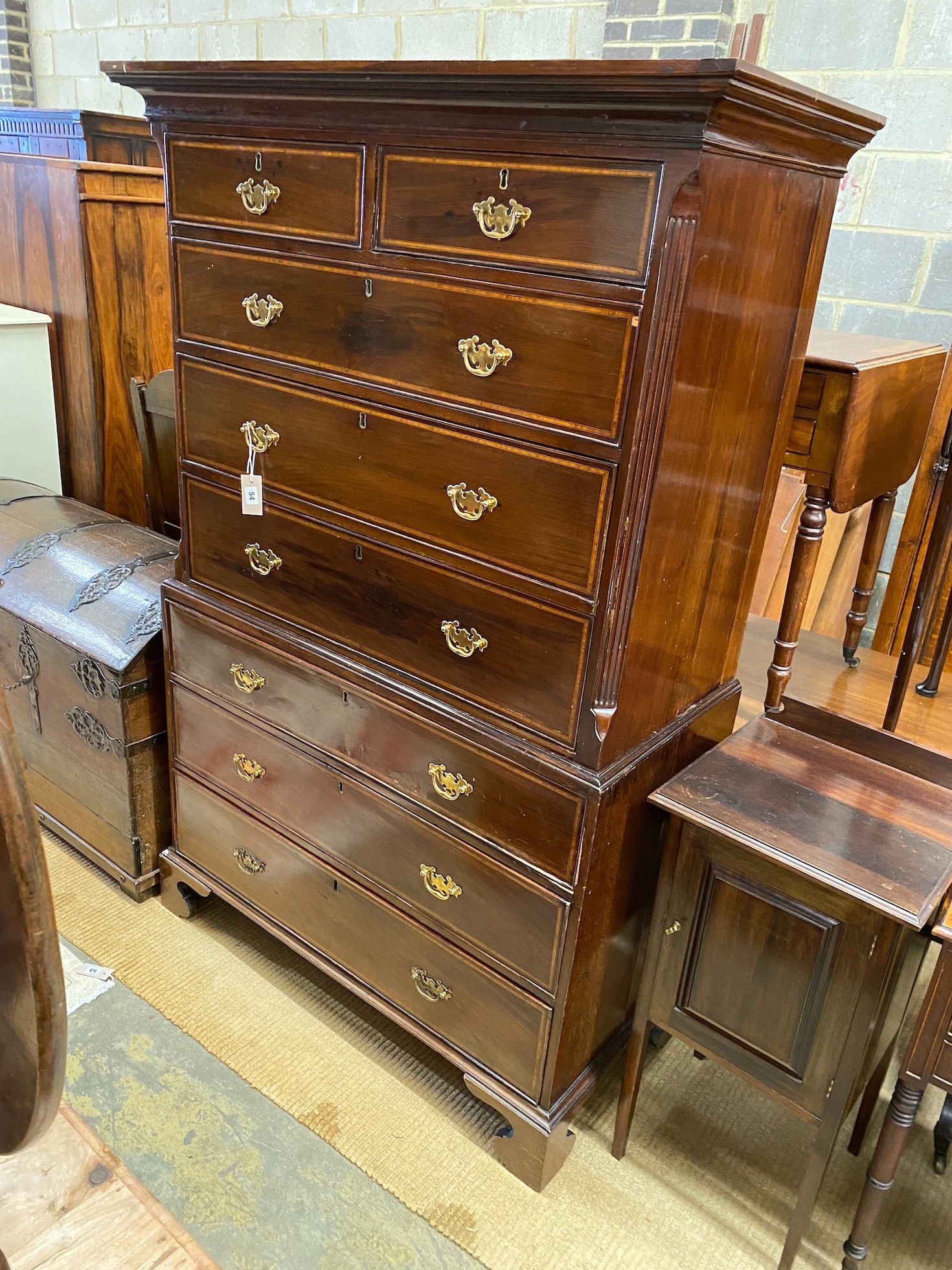 A George III banded mahogany chest on chest, width 112cm, depth 53cm, height 173cm